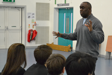 Pictured: Alex Wheatle with Ruislip High School pupils